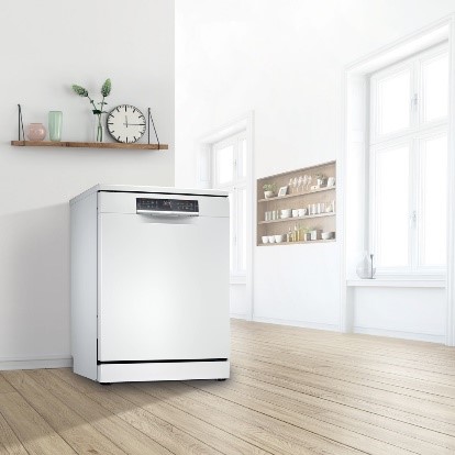 Freestanding dishwasher with flexible placement options in a kitchen without custom cabinetry.